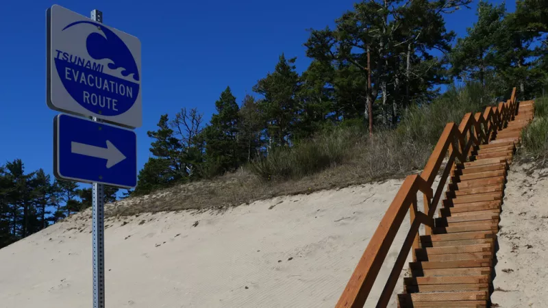 tsunami evacuation sign by hill