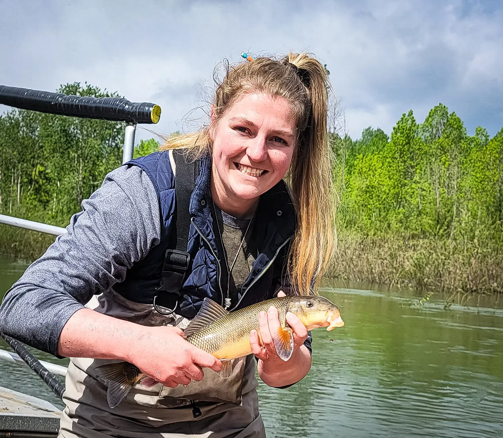 A person is holding a fish