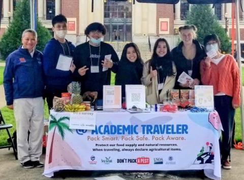 Academic Travelers Student Ambassadors staff a tabling event at Oregon State University Campus in December 2021
