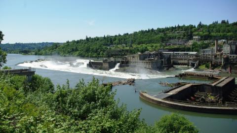 Willamette Falls in Oregon. A large papermill is on the far bank, below the falls. The water is diverted into it to provide power.. 